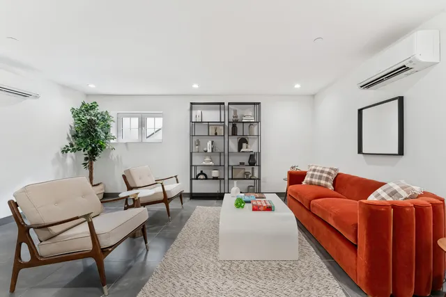 a bathroom with a sink and mirror with toilet
