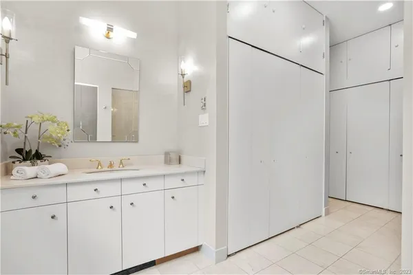 a bathroom with a double vanity sink and mirror