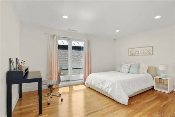 a bedroom with a bed and a table in it