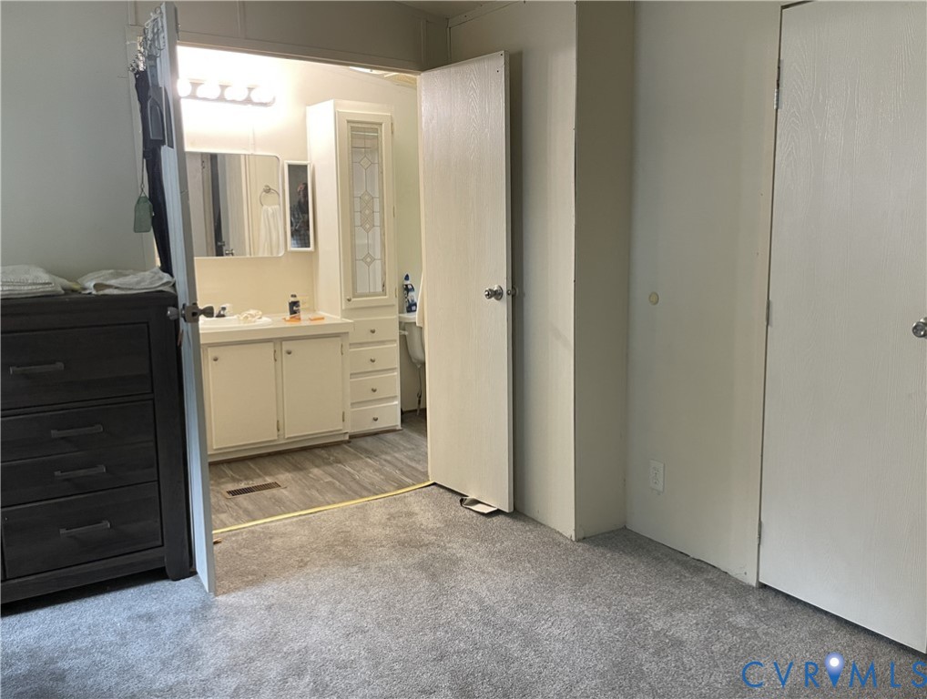 3114 Sheltons Road Drakes Branch, VA 23937 - Photo 12 of 20 a bathroom with a granite countertop sink and a mirror