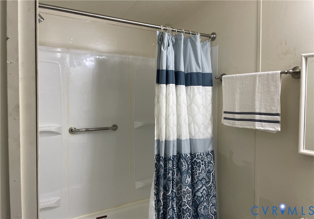 3114 Sheltons Road Drakes Branch, VA 23937 - Photo 13 of 20 a bathroom with a shower and a mirror