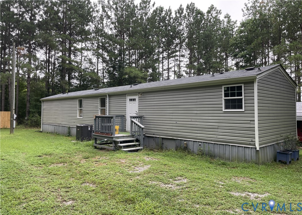 3114 Sheltons Road Drakes Branch, VA 23937 - Photo 5 of 20 a backyard of a house with table and chairs