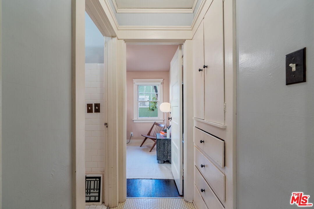 1767 Locust Street Pasadena, CA 91106 - Photo 11 of 28 a view of a hallway with wooden floor and a living room