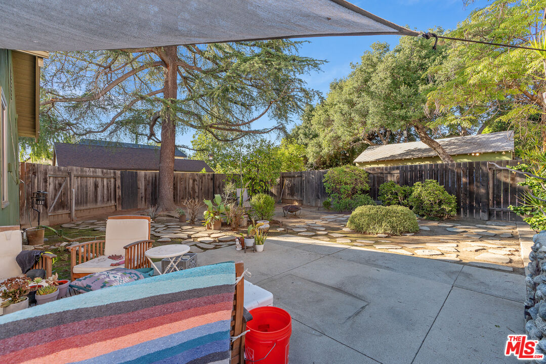 1767 Locust Street Pasadena, CA 91106 - Photo 16 of 28 a backyard of a house with yard and outdoor seating