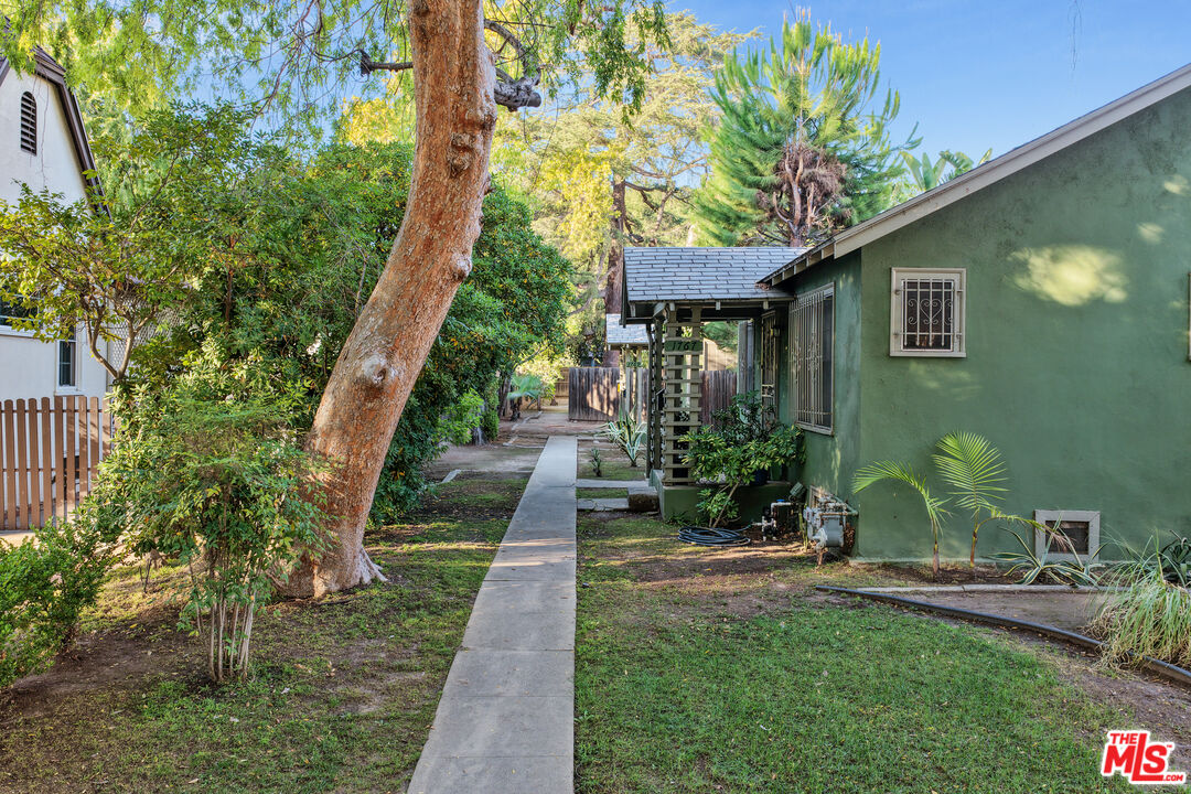 1767 Locust Street Pasadena, CA 91106 - Photo 3 of 28 a front view of a house with a yard