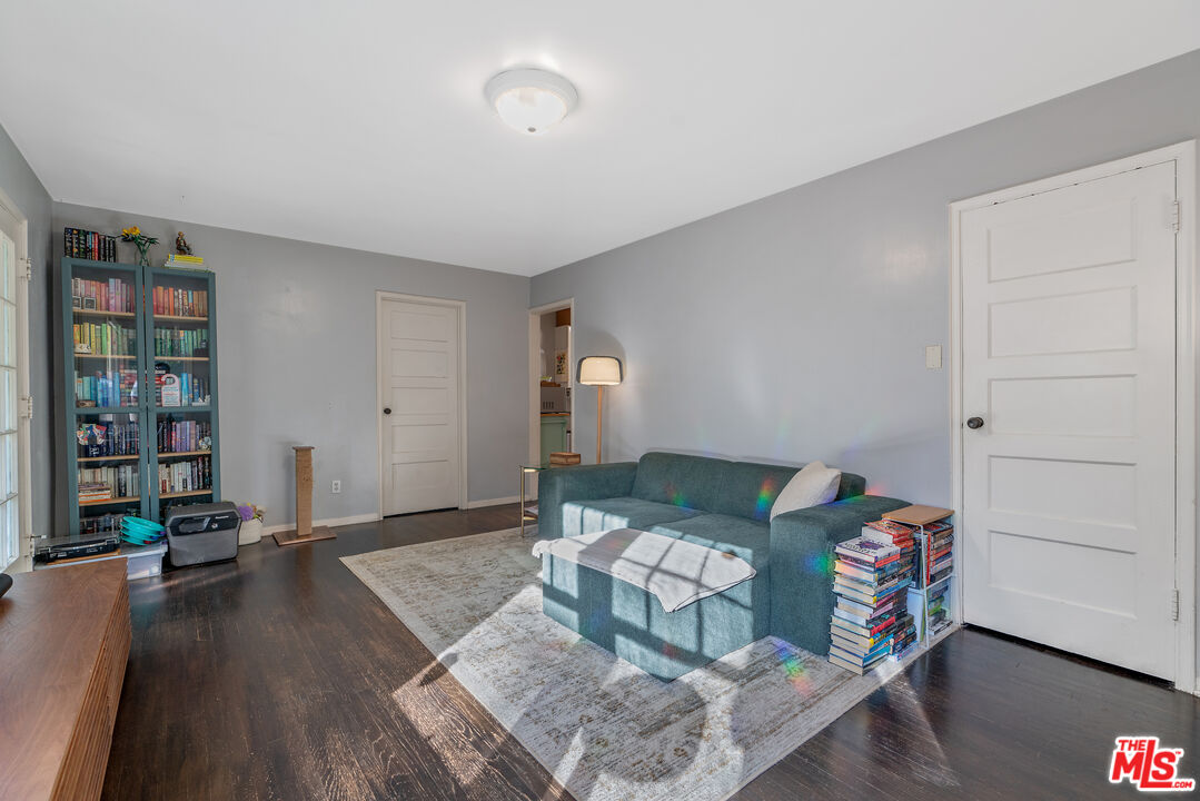 1767 Locust Street Pasadena, CA 91106 - Photo 6 of 28 a living room with furniture and a book shelf