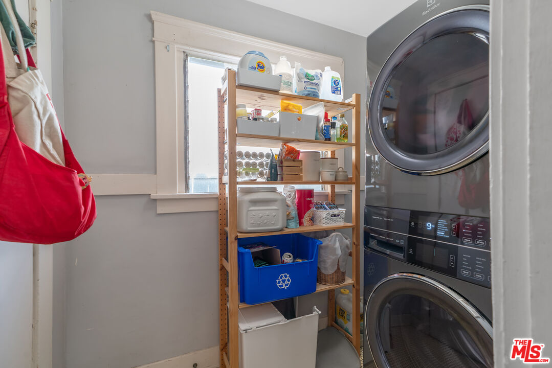 1767 Locust Street Pasadena, CA 91106 - Photo 10 of 28 a close view of walk in closet with clothes and shoes