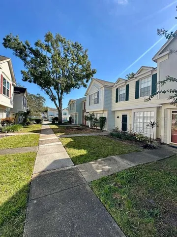a view of house with yard