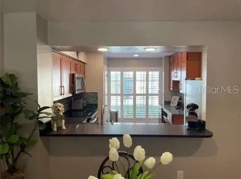 a kitchen with a table and chairs in it