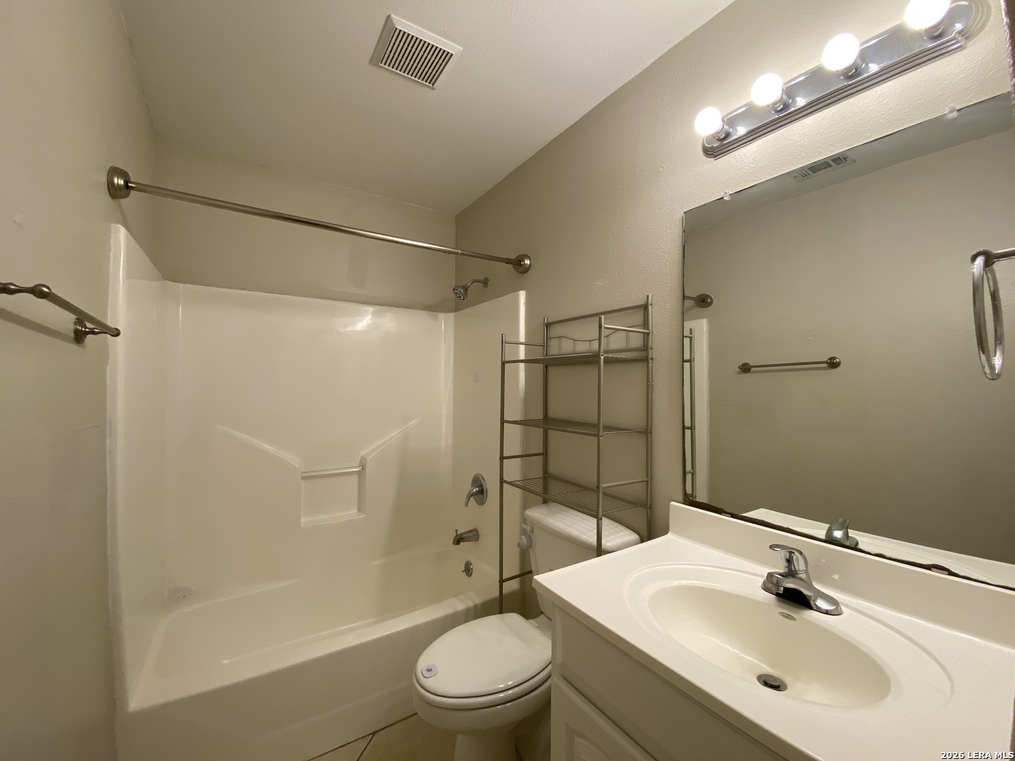 108 Ocotillo Jourdanton, TX 78026 - Photo 13 of 14 a bathroom with a sink toilet and shower