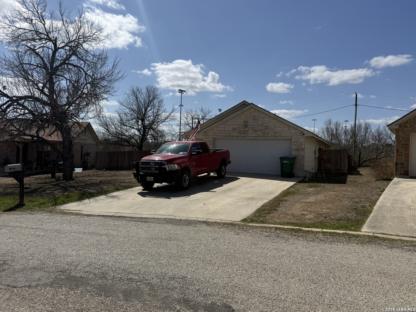 108 Ocotillo Jourdanton, TX 78026 - Photo 2 of 14 a front view of a house with a yard