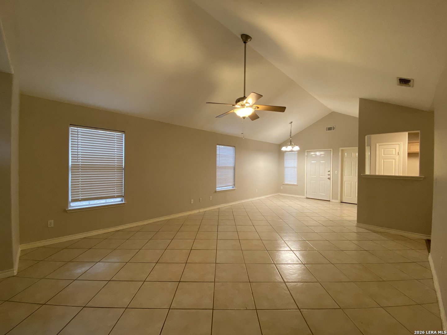 108 Ocotillo Jourdanton, TX 78026 - Photo 4 of 14 a view of an empty room with a chandelier fan