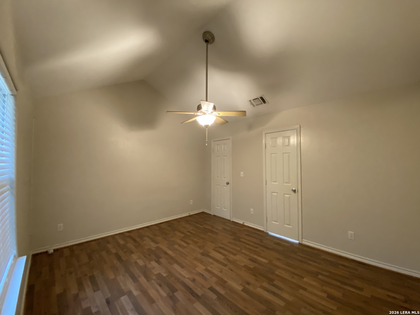 108 Ocotillo Jourdanton, TX 78026 - Photo 8 of 14 a view of empty room with wooden floor