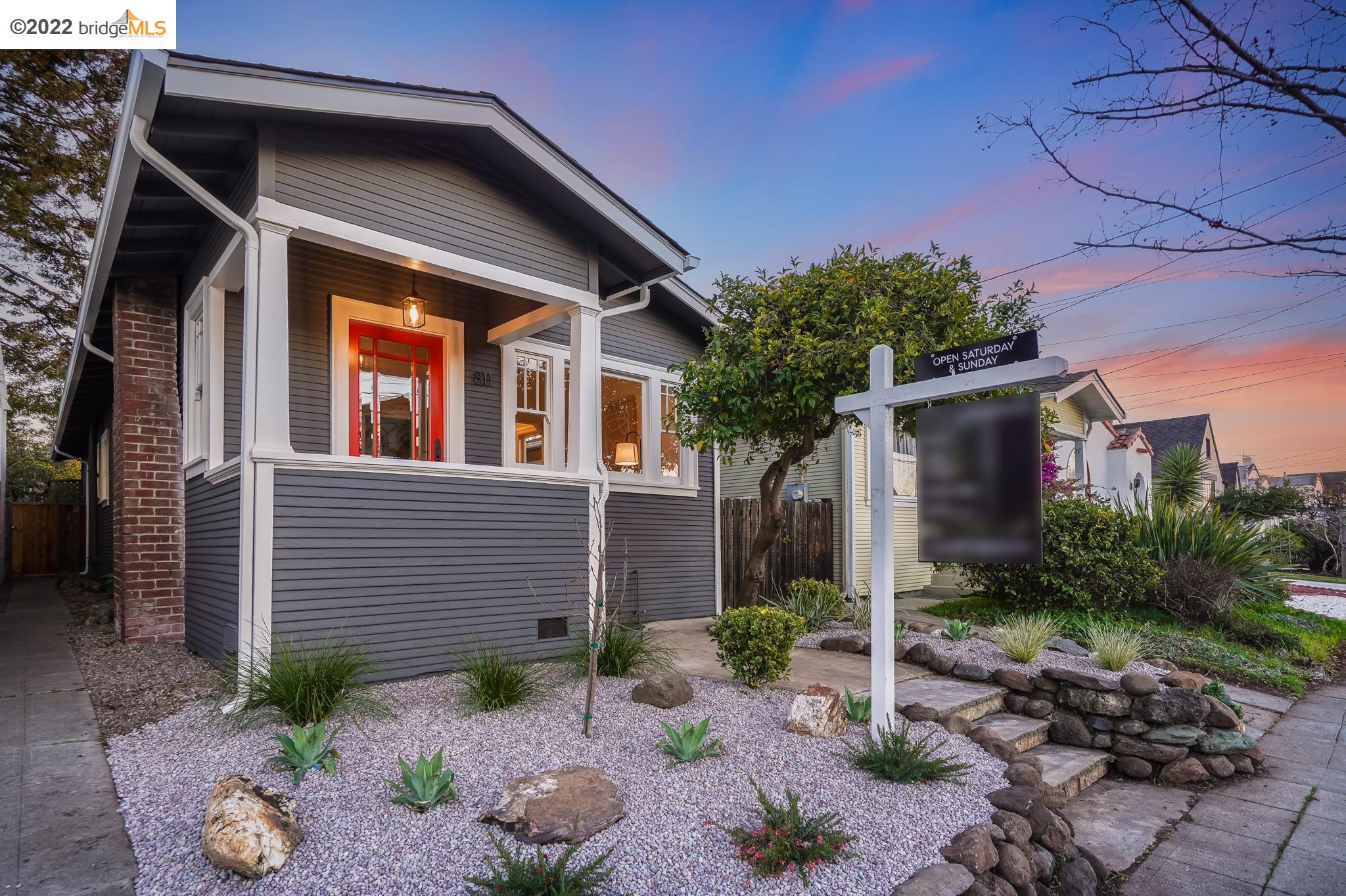 a front view of a house with garden