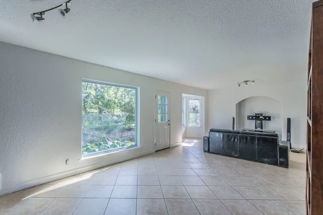 a view of an empty room with a window