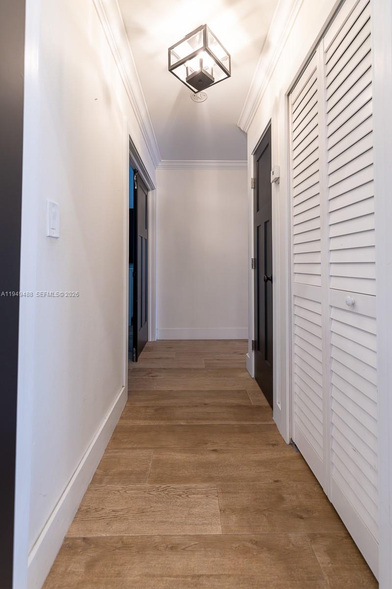 16141 Southwest 156th Avenue Miami, FL 33187 - Photo 12 of 35 a view of a hallway with wooden floor