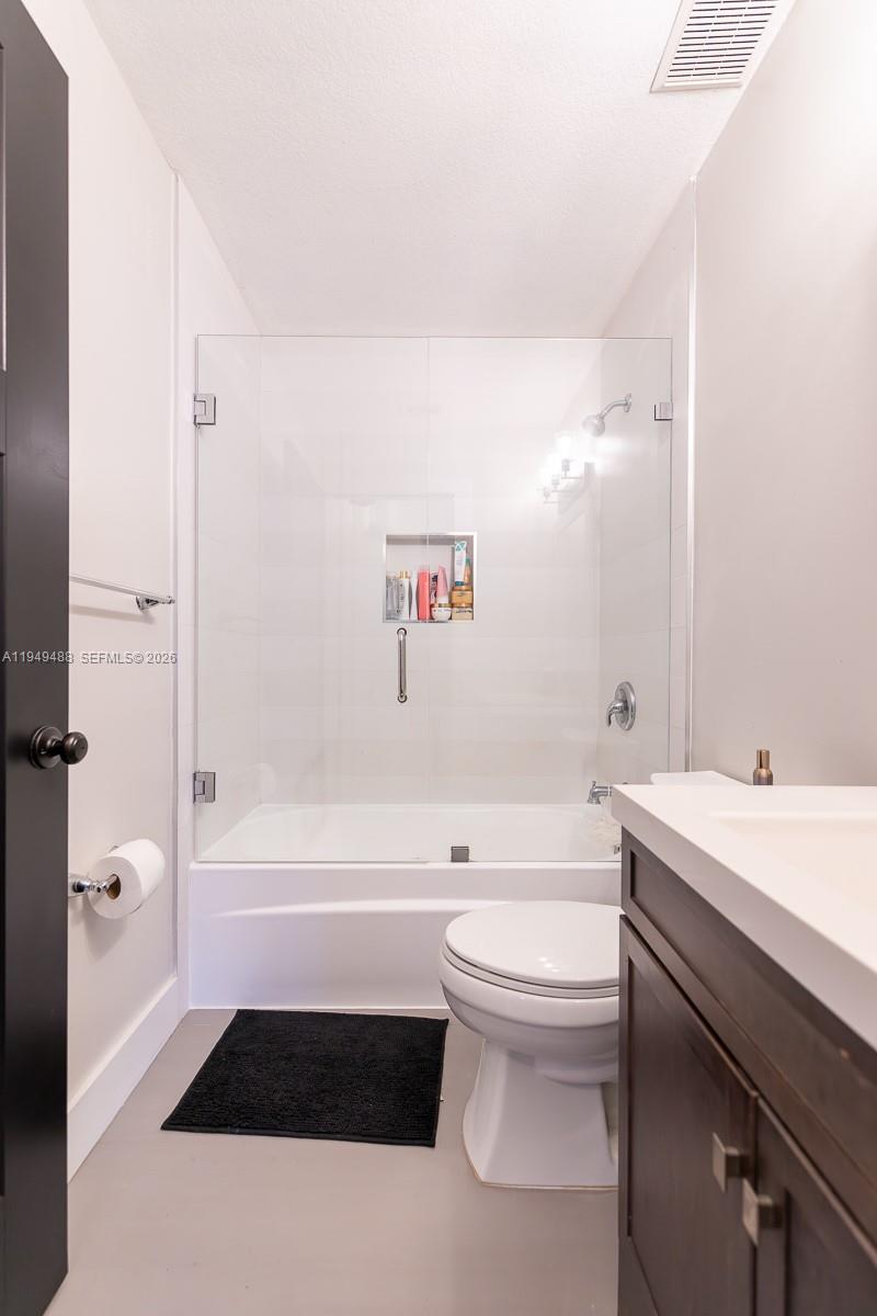 16141 Southwest 156th Avenue Miami, FL 33187 - Photo 25 of 35 a bathroom with a sink a toilet and a bathtub