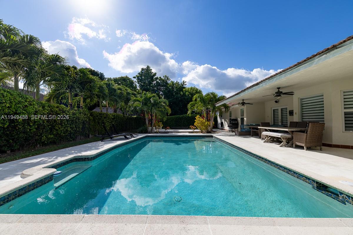 16141 Southwest 156th Avenue Miami, FL 33187 - Photo 31 of 35 a view of a swimming pool with a patio