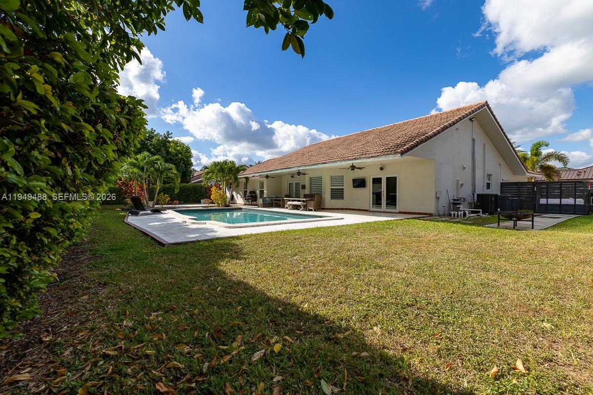 16141 Southwest 156th Avenue Miami, FL 33187 - Photo 32 of 35 a swimming pool view with a outdoor seating