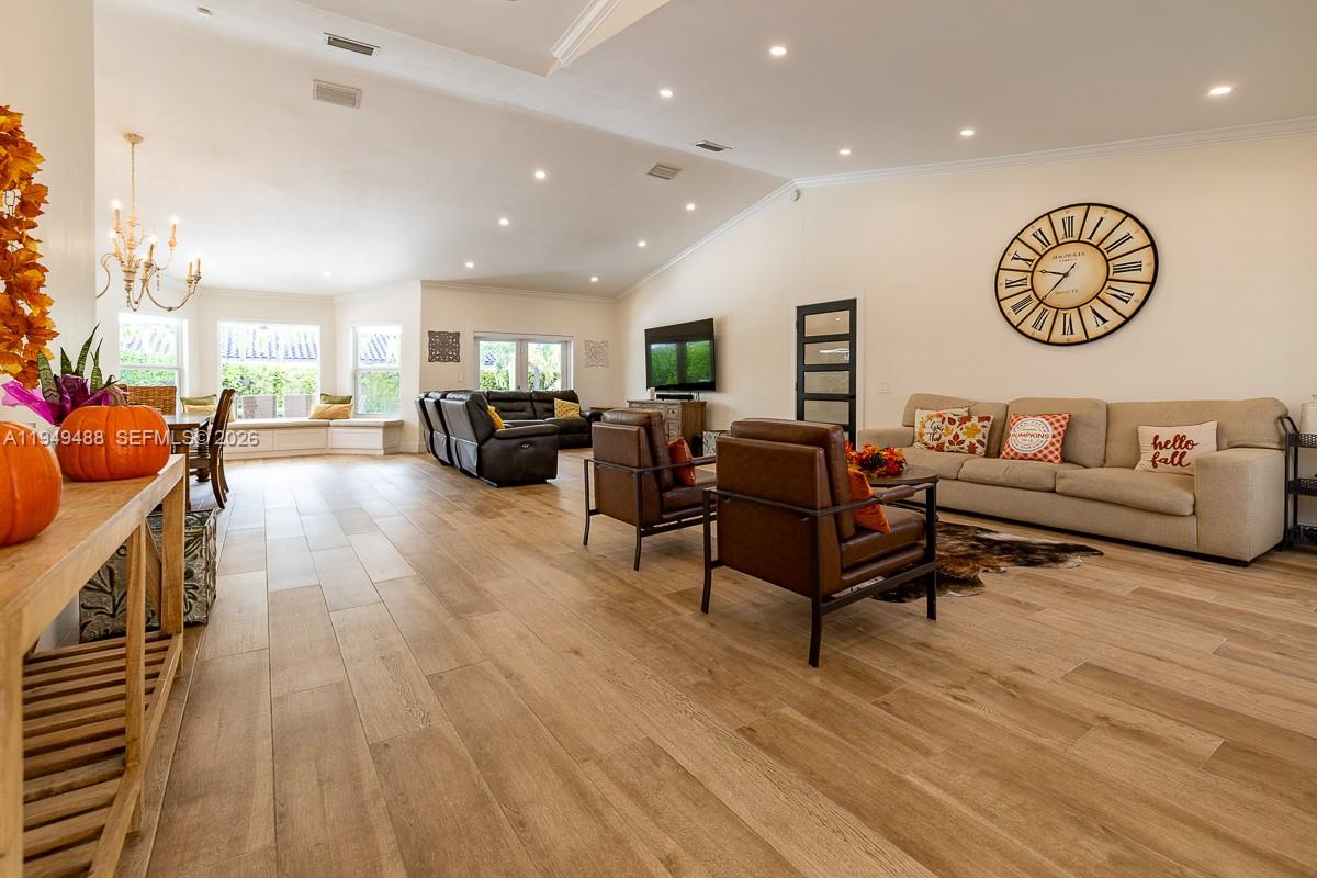 16141 Southwest 156th Avenue Miami, FL 33187 - Photo 4 of 35 a living room with furniture and a wooden floor