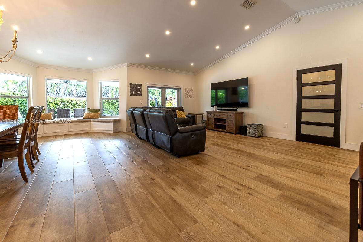 16141 Southwest 156th Avenue Miami, FL 33187 - Photo 5 of 35 a living room with furniture and a flat screen tv