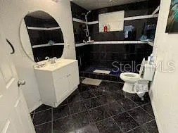 a bathroom with a sink and a toilet