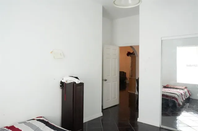 a view of hallway with wooden floor