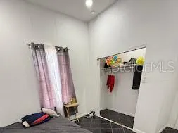 a view of a room with clothes and shoes