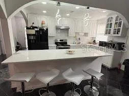 a large room with lots of chairs and mirrors