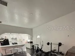 a view of a livingroom with furniture and a flat screen tv