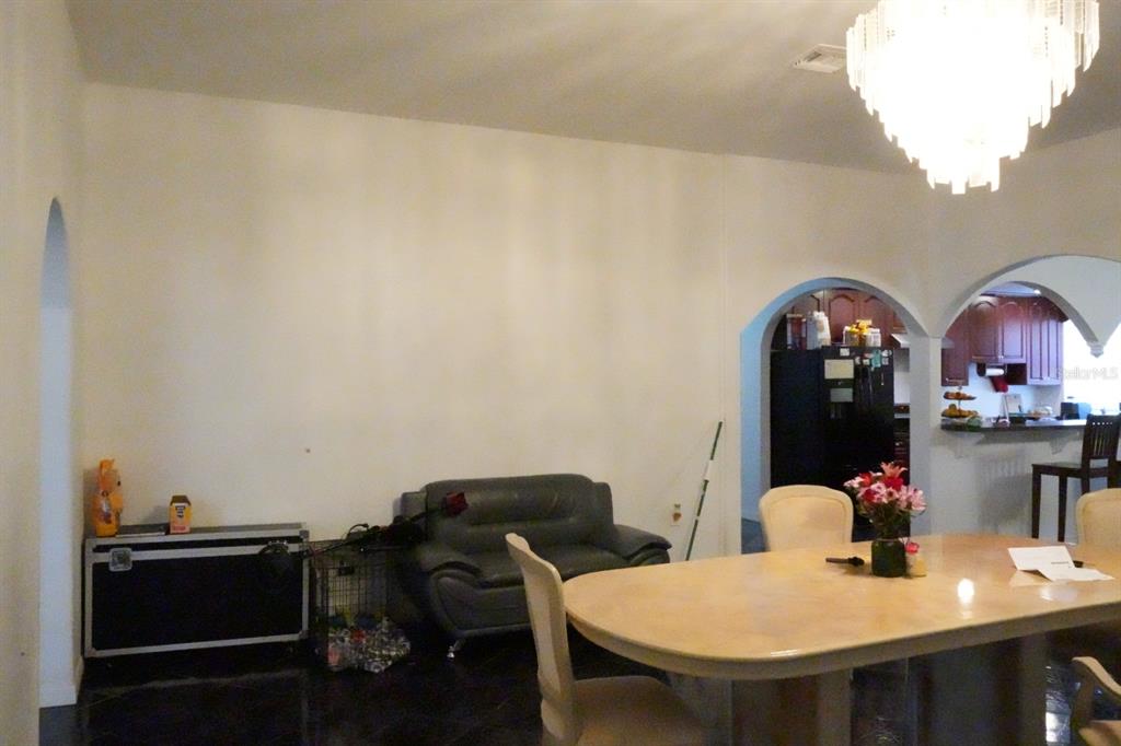 7040 Lumberton Road Zephyrhills, FL 33540 - Photo 6 of 34 a view of a dining room with furniture