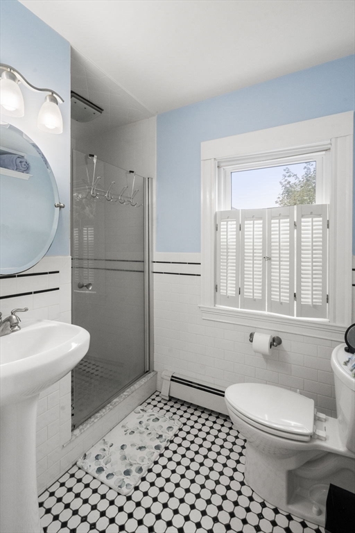 68 Edgewater Road Hull, MA 02045 - Photo 14 of 39 a bathroom with a sink a toilet and shower