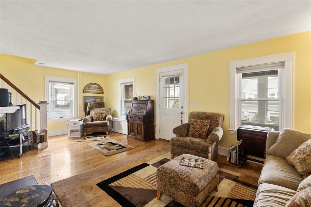 68 Edgewater Road Hull, MA 02045 - Photo 15 of 39 a living room with furniture or couch and a flat screen tv