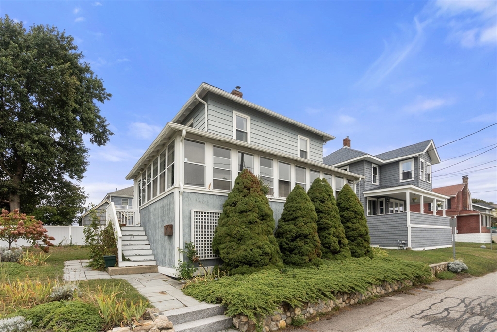 68 Edgewater Road Hull, MA 02045 - Photo 2 of 39 a front view of a house with a yard