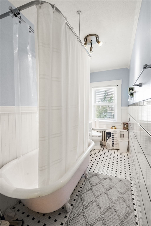 68 Edgewater Road Hull, MA 02045 - Photo 21 of 39 a large white tub sitting in a bathroom next to a window