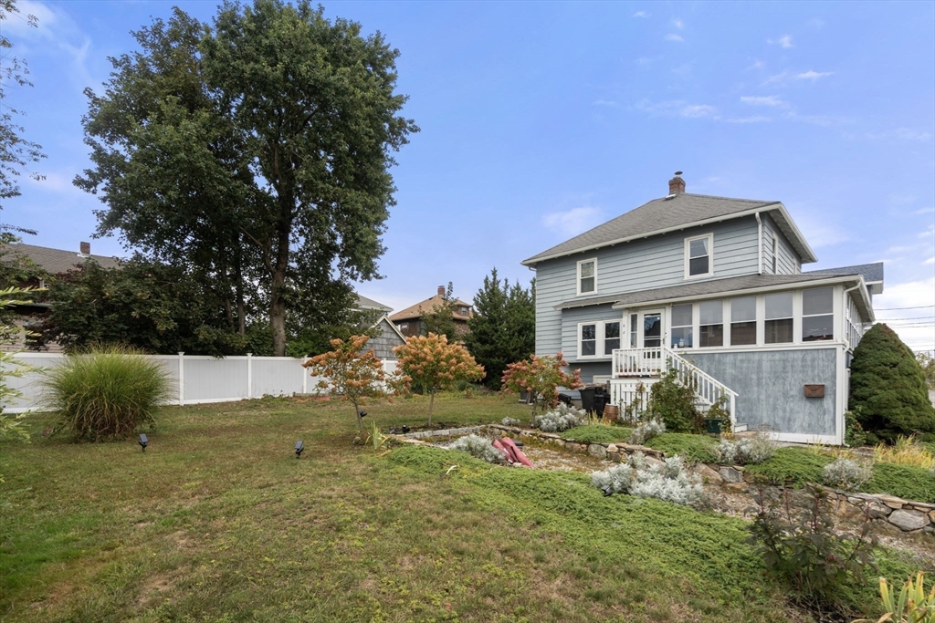 68 Edgewater Road Hull, MA 02045 - Photo 27 of 39 a front view of a house with garden