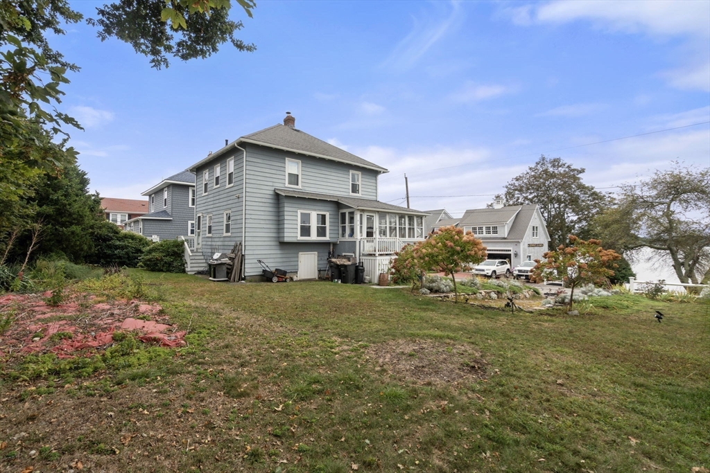 68 Edgewater Road Hull, MA 02045 - Photo 28 of 39 a front view of a house with a yard