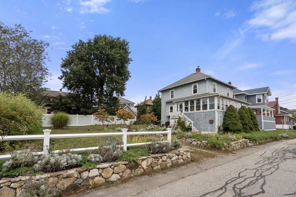 68 Edgewater Road Hull, MA 02045 - Photo 29 of 39 a front view of a house with a yard