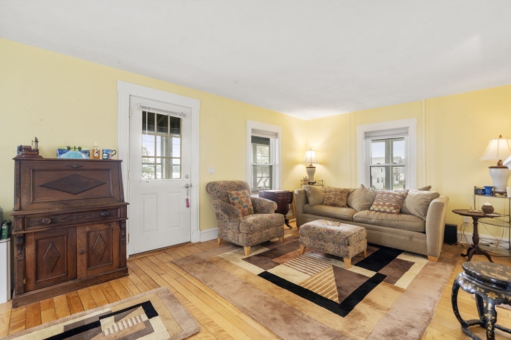 68 Edgewater Road Hull, MA 02045 - Photo 7 of 39 a living room with furniture and a flat screen tv