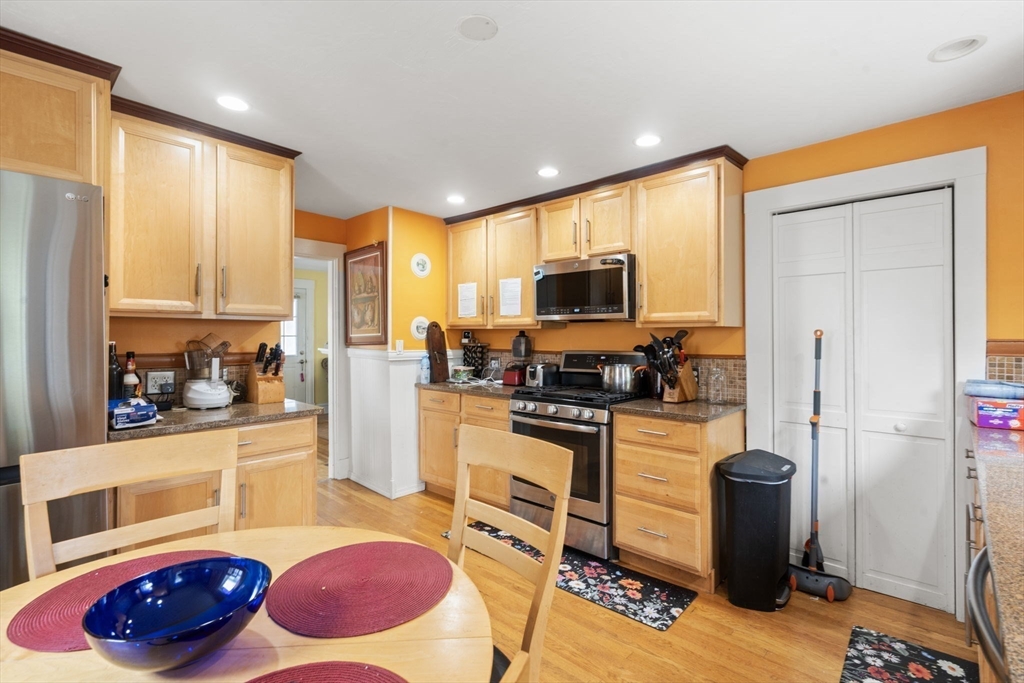 68 Edgewater Road Hull, MA 02045 - Photo 9 of 39 a kitchen with stainless steel appliances a stove a sink a refrigerator and cabinets