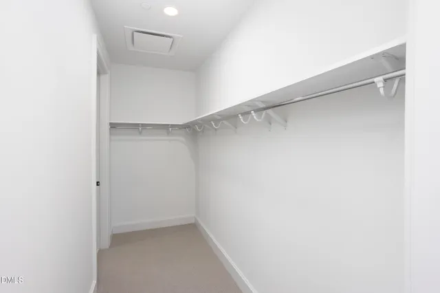 a bathroom with a granite countertop sink a mirror and shower