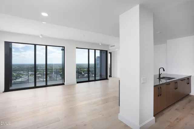 a view of an empty room with glass door