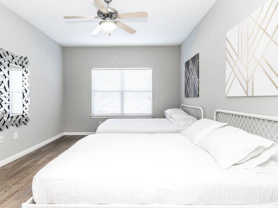 2502 Leon Street, Unit 217 Austin, TX 78705 - Photo 3 of 6 a bedroom with a large bed and a window