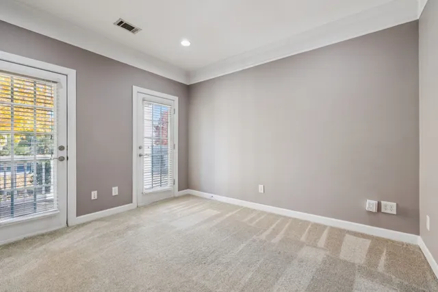 a view of a ceiling fan and wooden floor