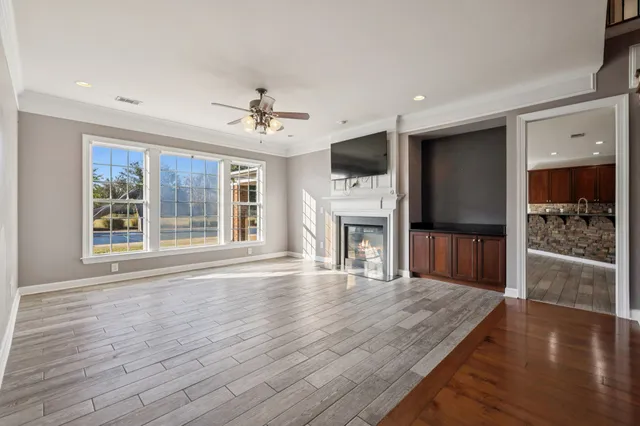 a kitchen with stainless steel appliances granite countertop a refrigerator stove and oven