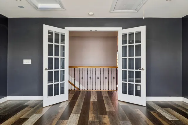 a spacious bathroom with a tub shower and sink