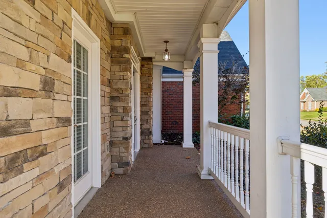 a view of a porch of a house