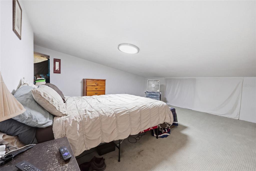 401 Southeast Falcon Road Branford, FL 32008 - Photo 44 of 76 a bed room with a bed and a chair
