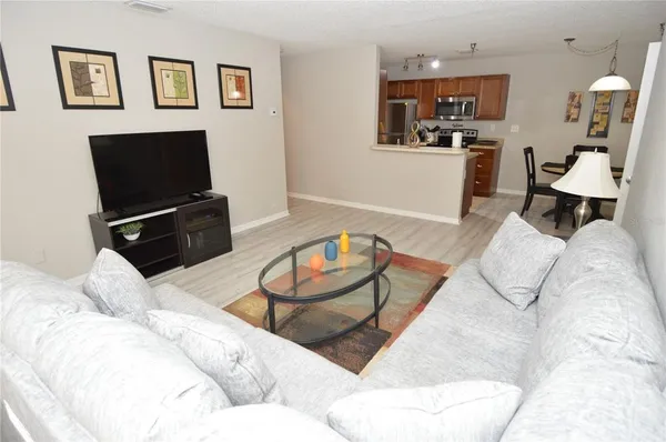 a room with a small stove and a wooden floor