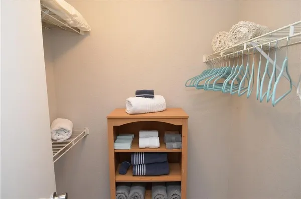 a view of a lake with houses in the background